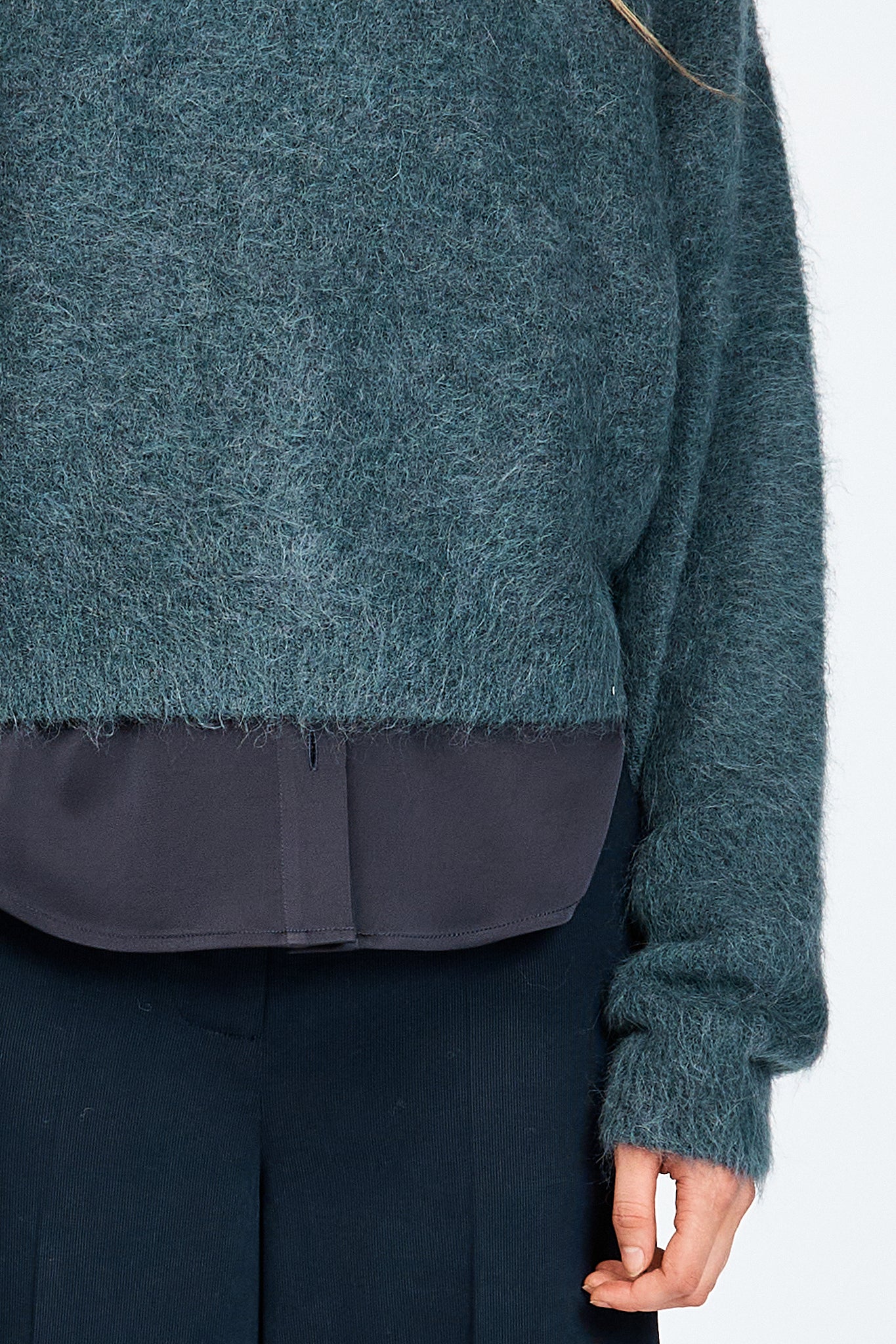 Woman wearing woollen jumper in blue