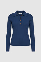 Woman wearing blue knitted long sleeve top