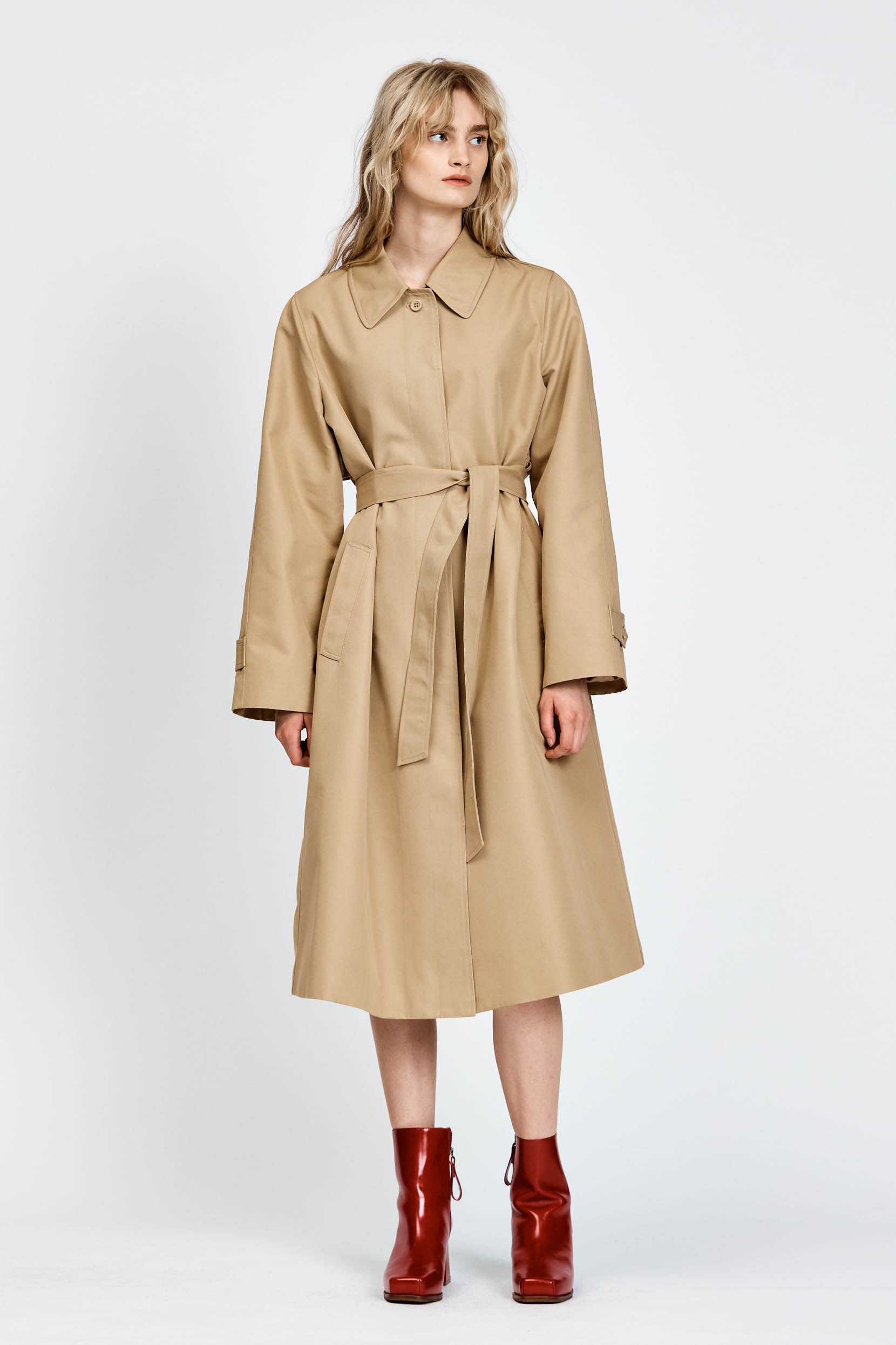 Model wearing beige trench coat
