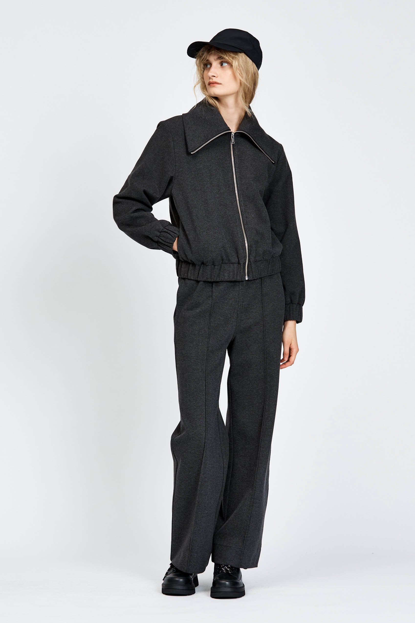 Model wearing relaxed silhouette charcoal pant