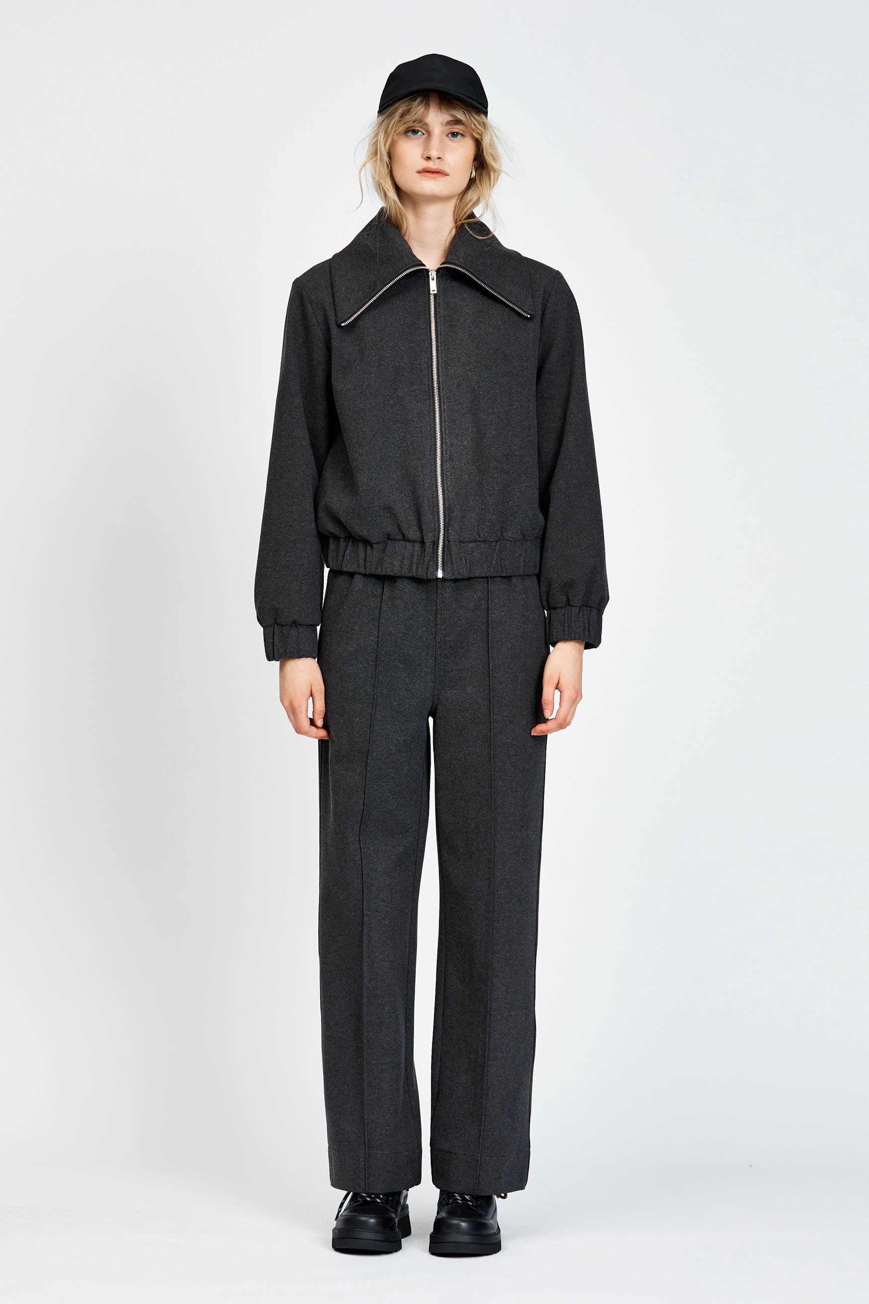 Model wearing relaxed silhouette charcoal pant