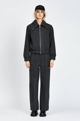 Model wearing relaxed silhouette charcoal pant