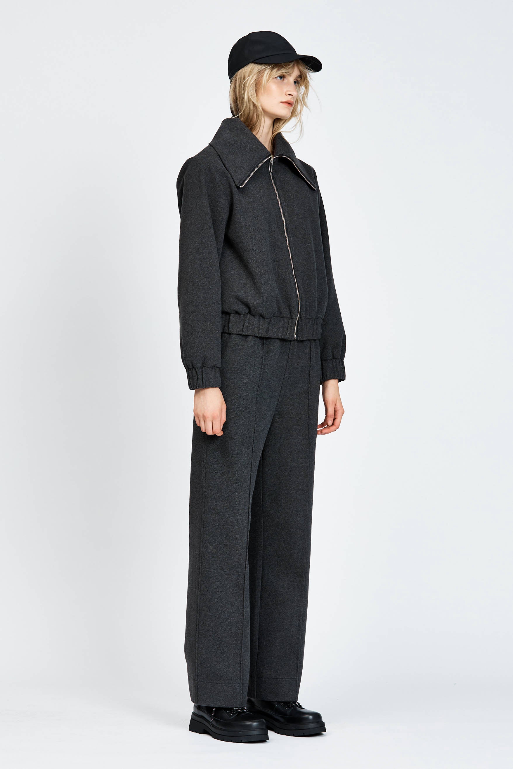 Model wearing relaxed silhouette charcoal pant