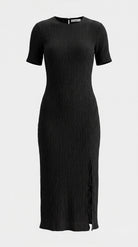 Short sleeve black dress with side slit on light grey background
