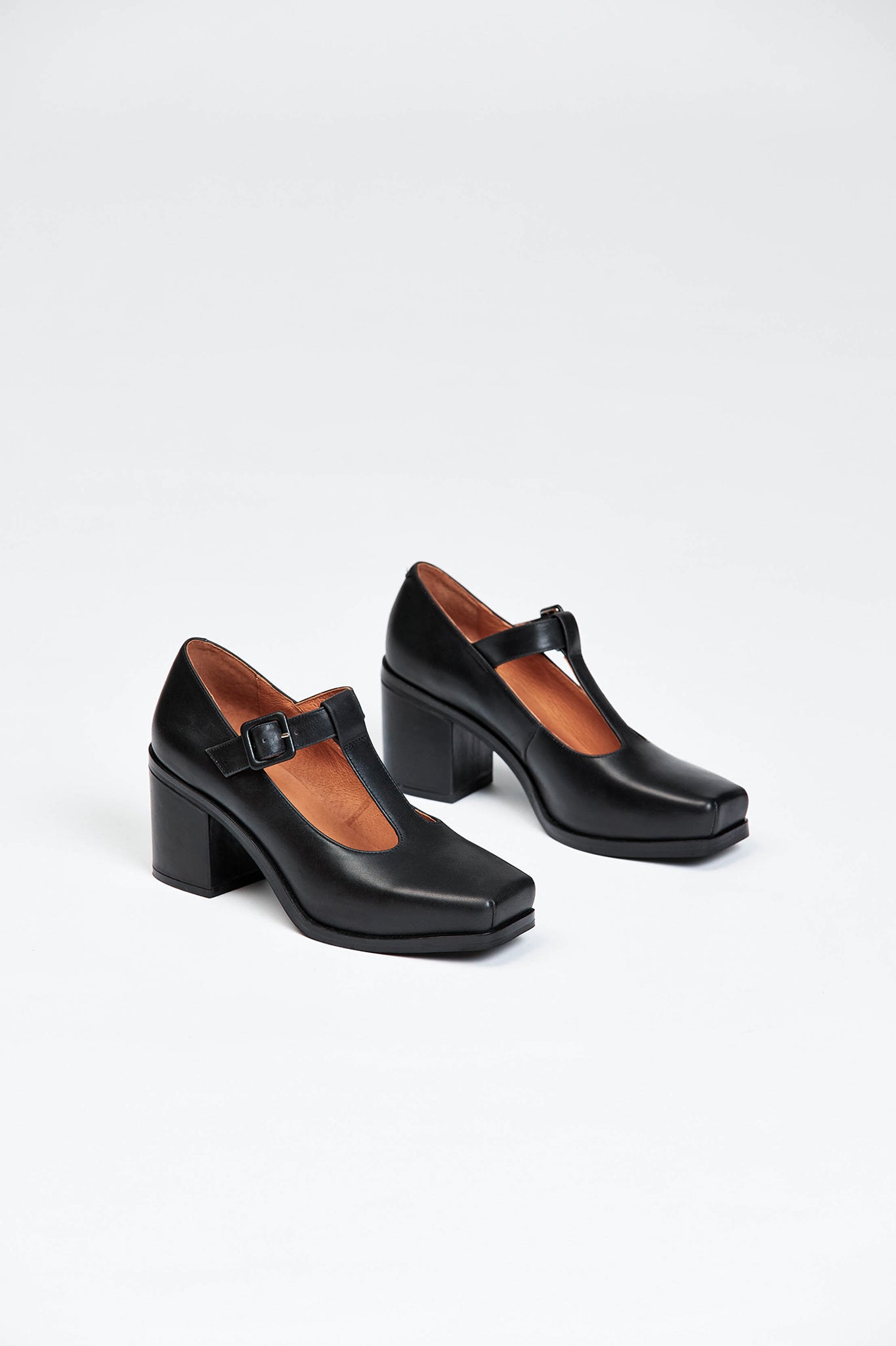 Black block heel shoe with buckle enclosure