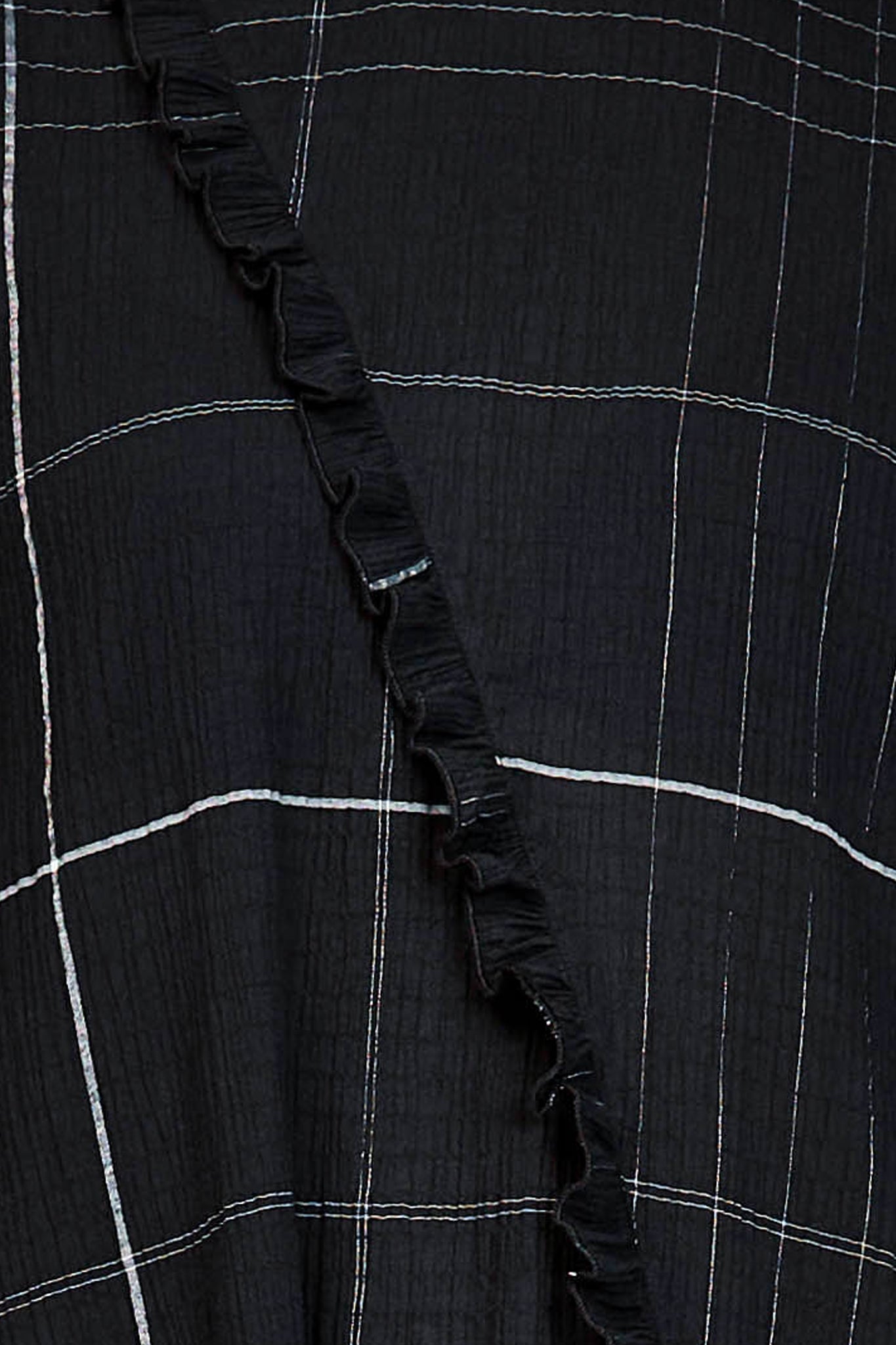 Fabric swatch of the black and white check material of the dress