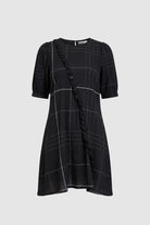 Image of the black and white check mini dress on light grey background