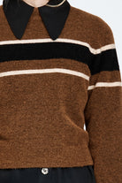Woman wearing a woollen brown jumper