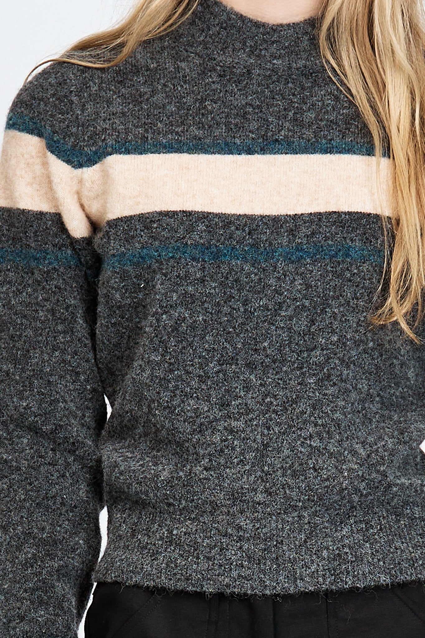 Woman wearing a soft woollen jumper in grey