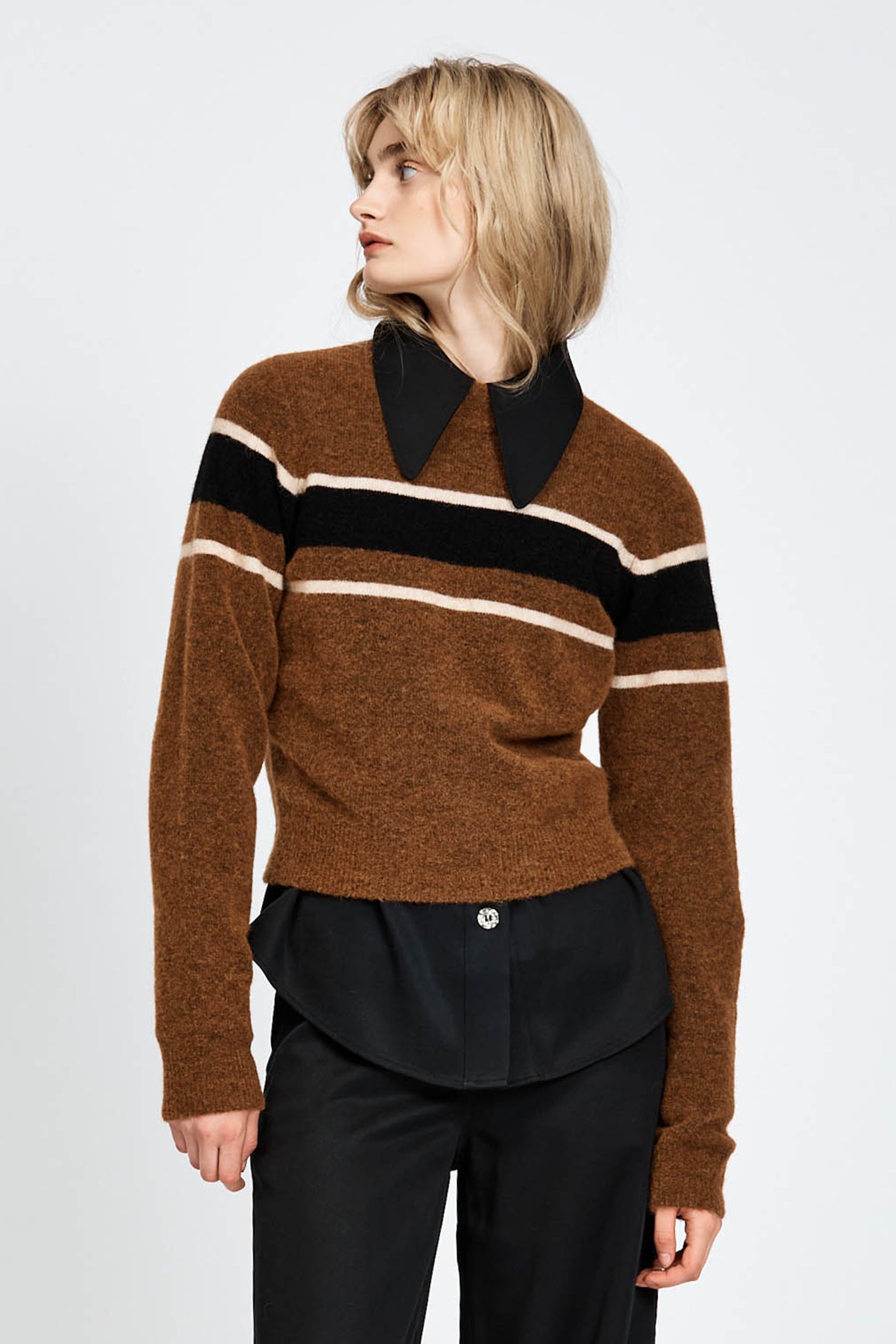 Woman wearing a woollen brown jumper