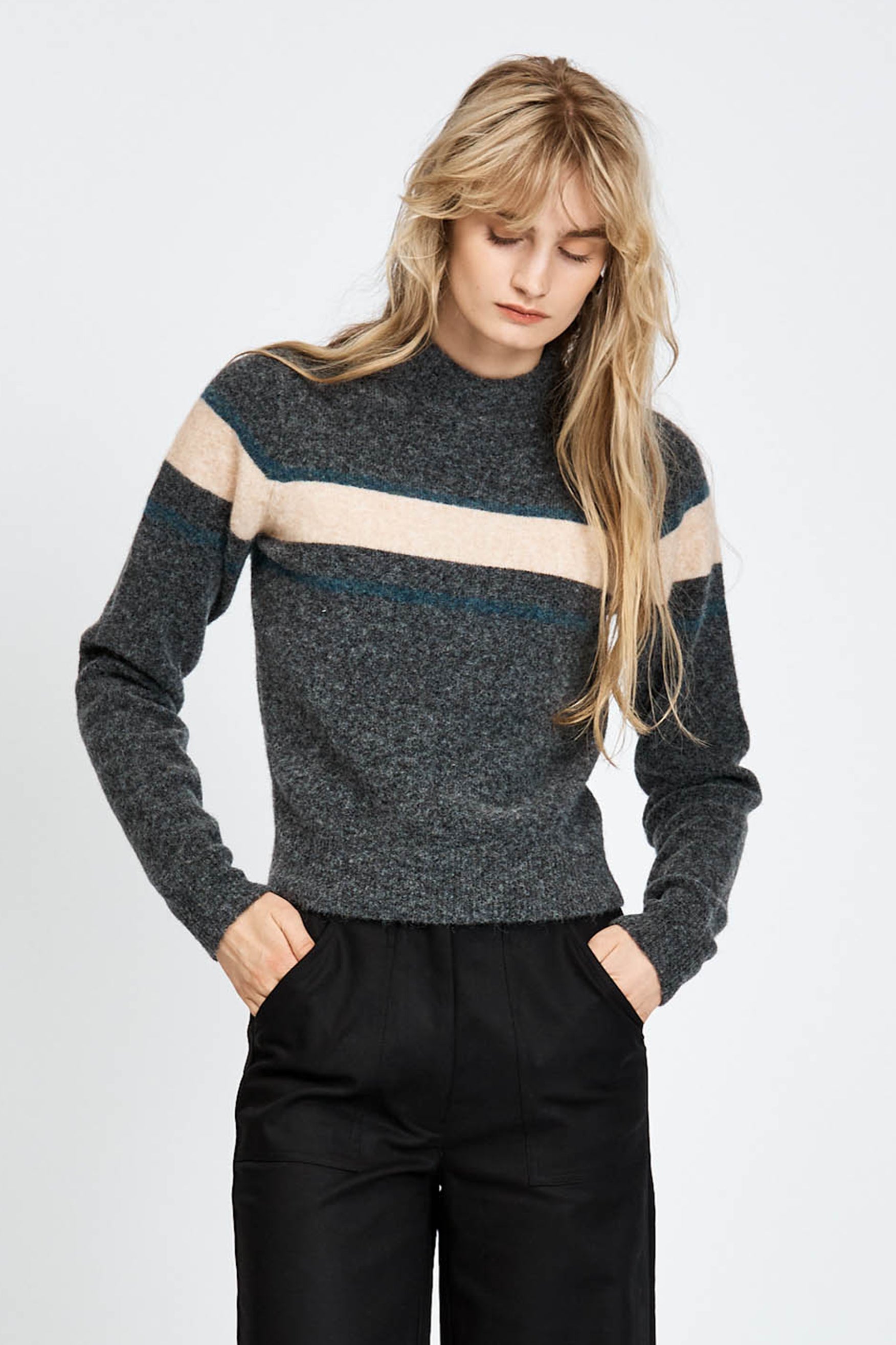 Woman wearing a soft woollen jumper in grey