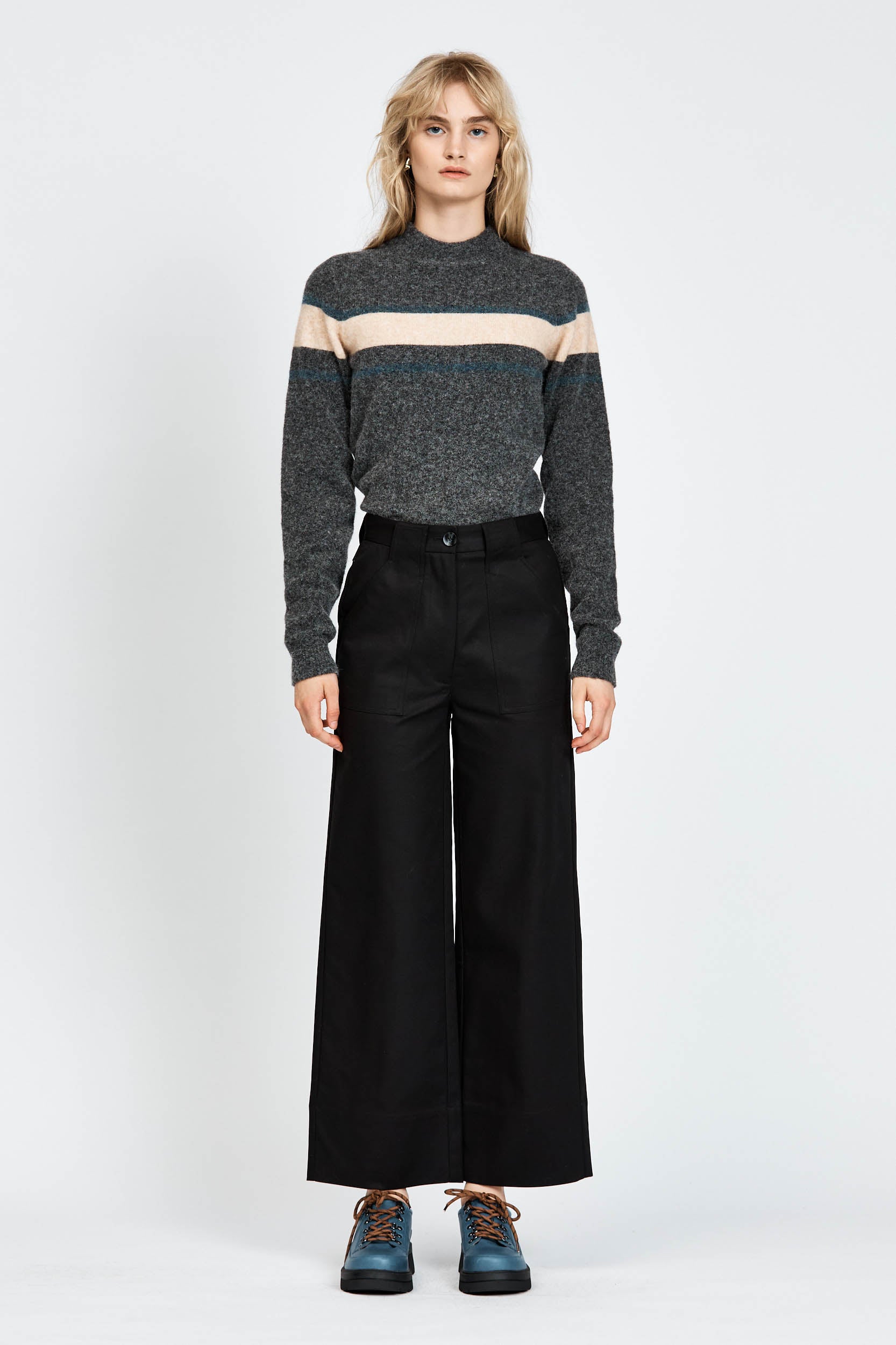 Woman wearing a soft woollen jumper in grey