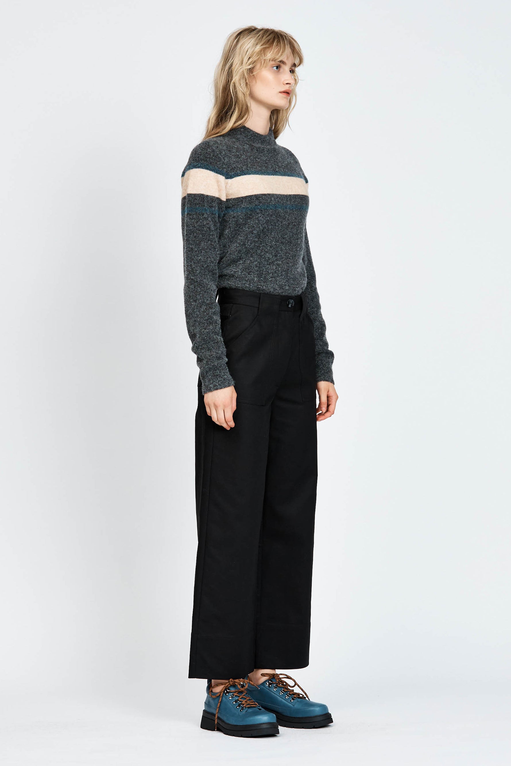 Woman wearing a soft woollen jumper in grey