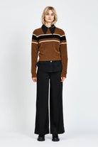 Woman wearing a woollen brown jumper