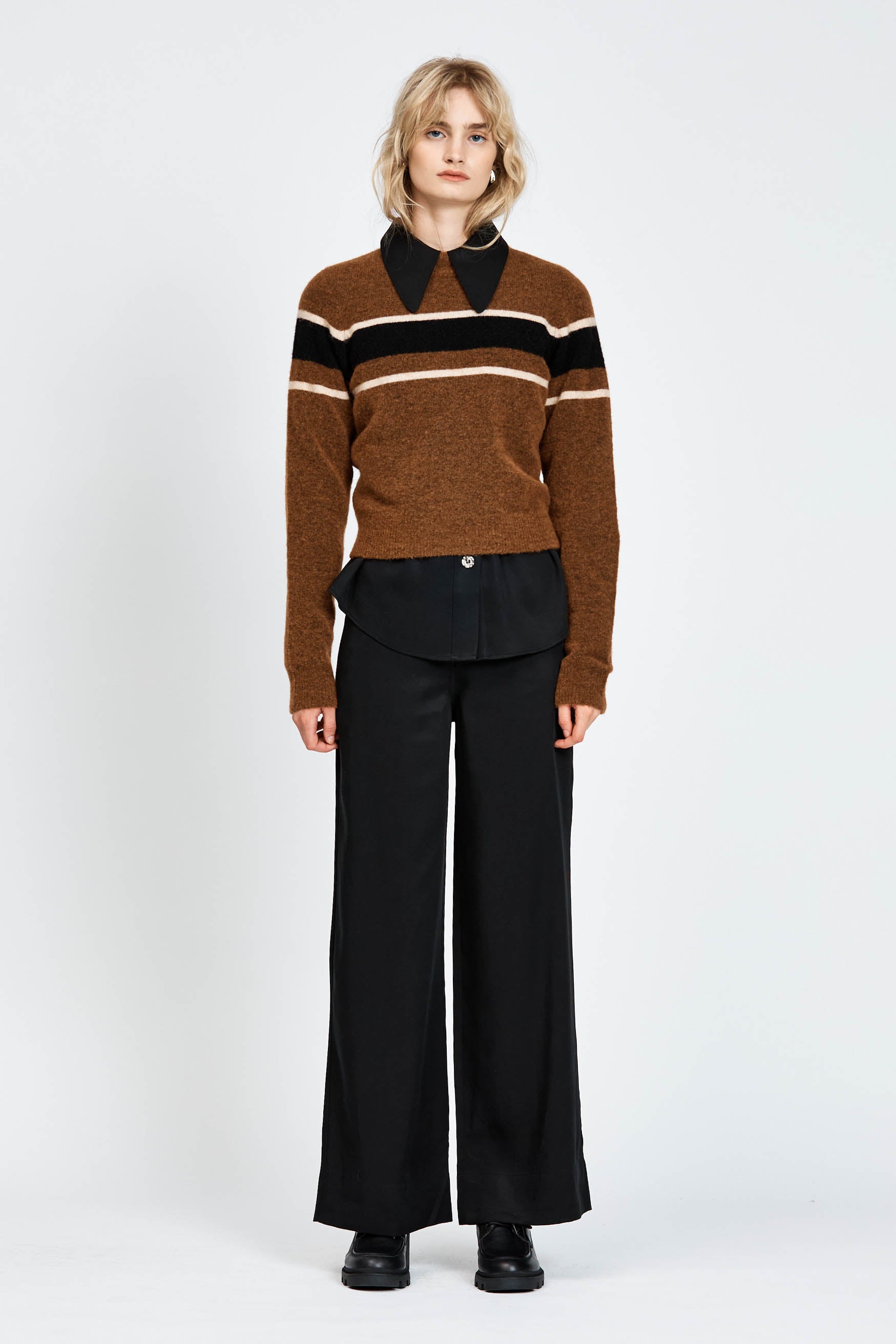 Woman wearing a woollen brown jumper