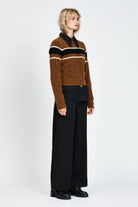 Woman wearing a woollen brown jumper