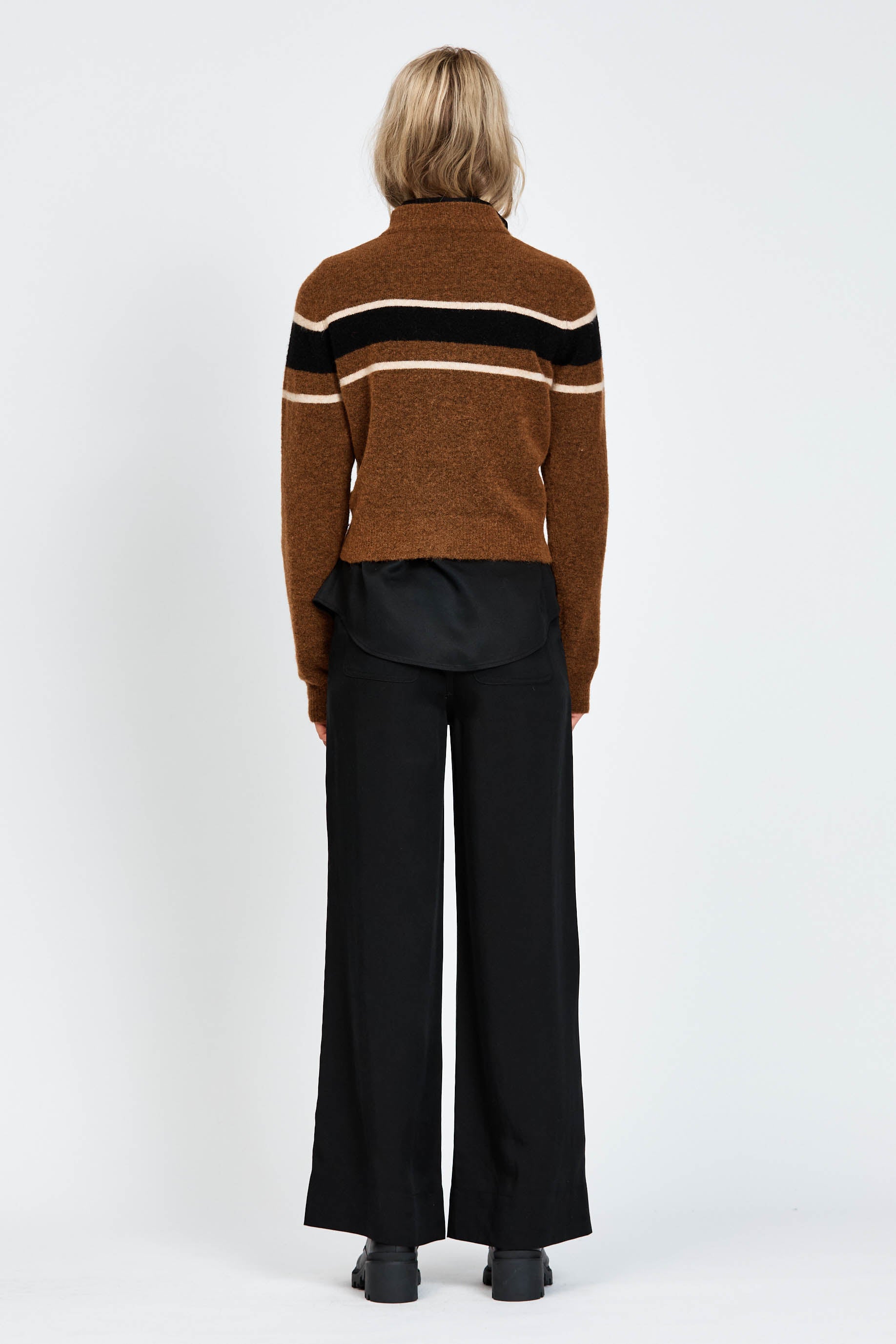 Woman wearing a woollen brown jumper