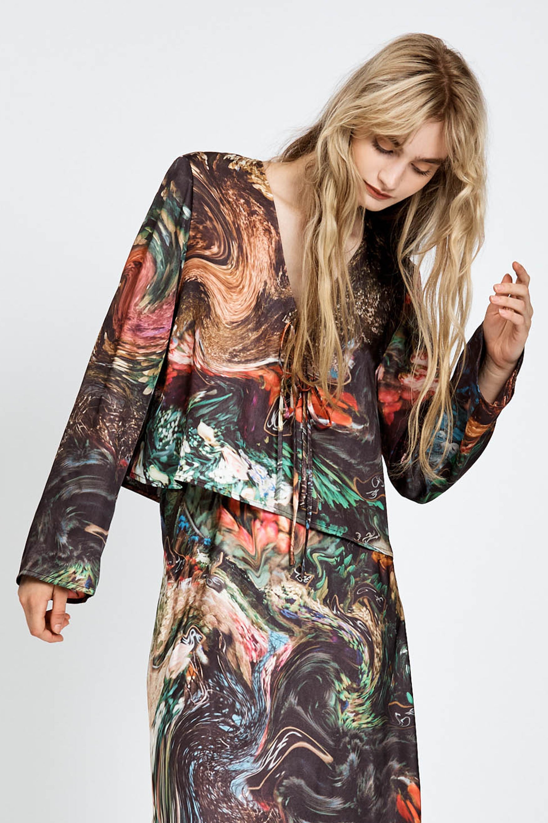 Model wearing a flowy floral print top