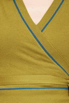Fabric swatch of green top with teal piping