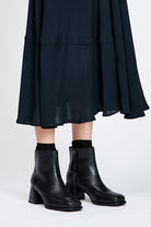 Black leather ankle boot with a block heel