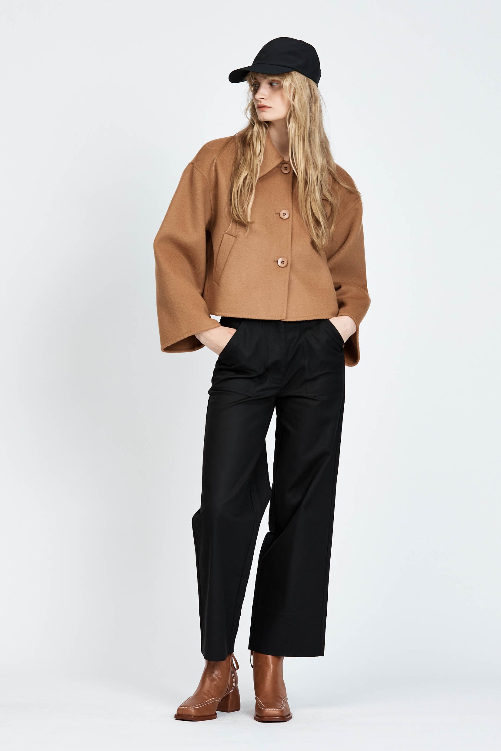 Model wearing a cropped camel woollen jacket