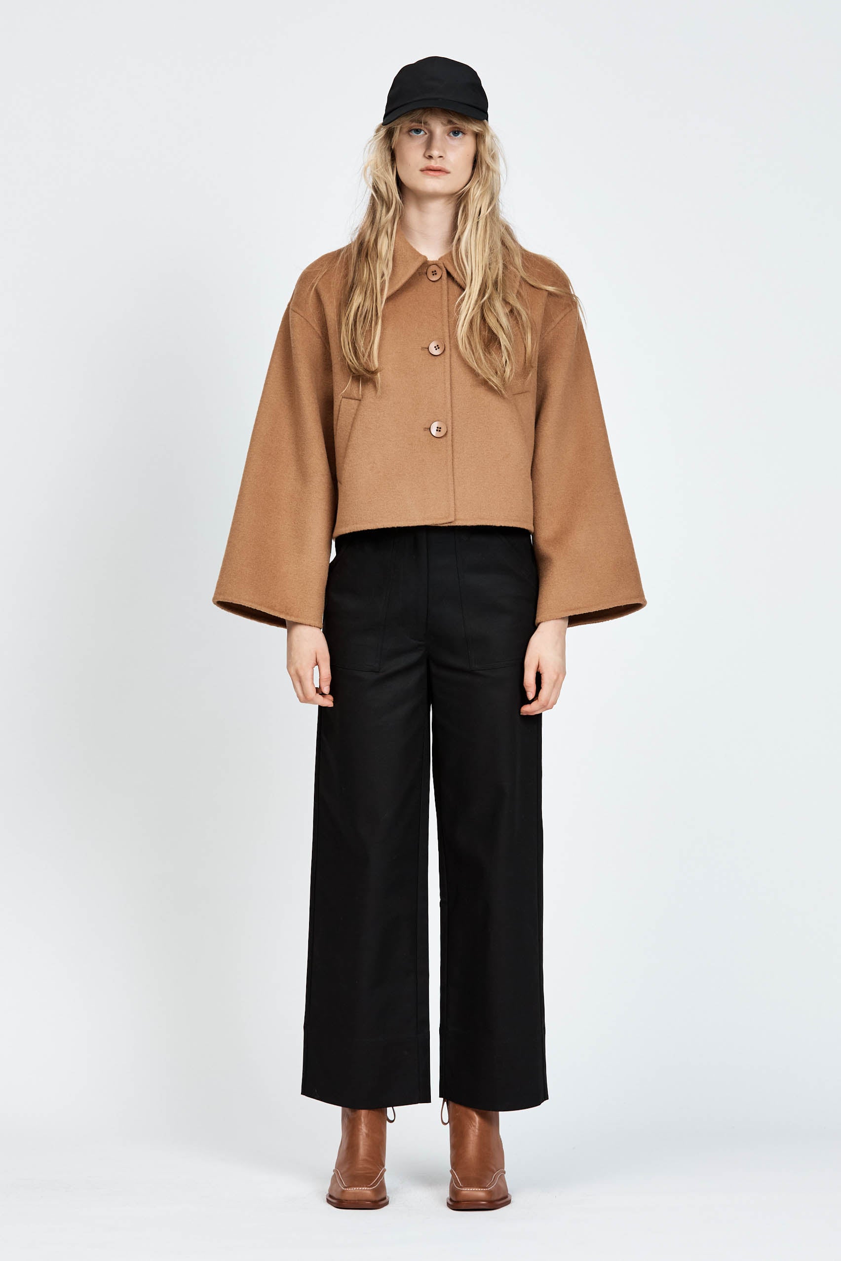 Model wearing black pants