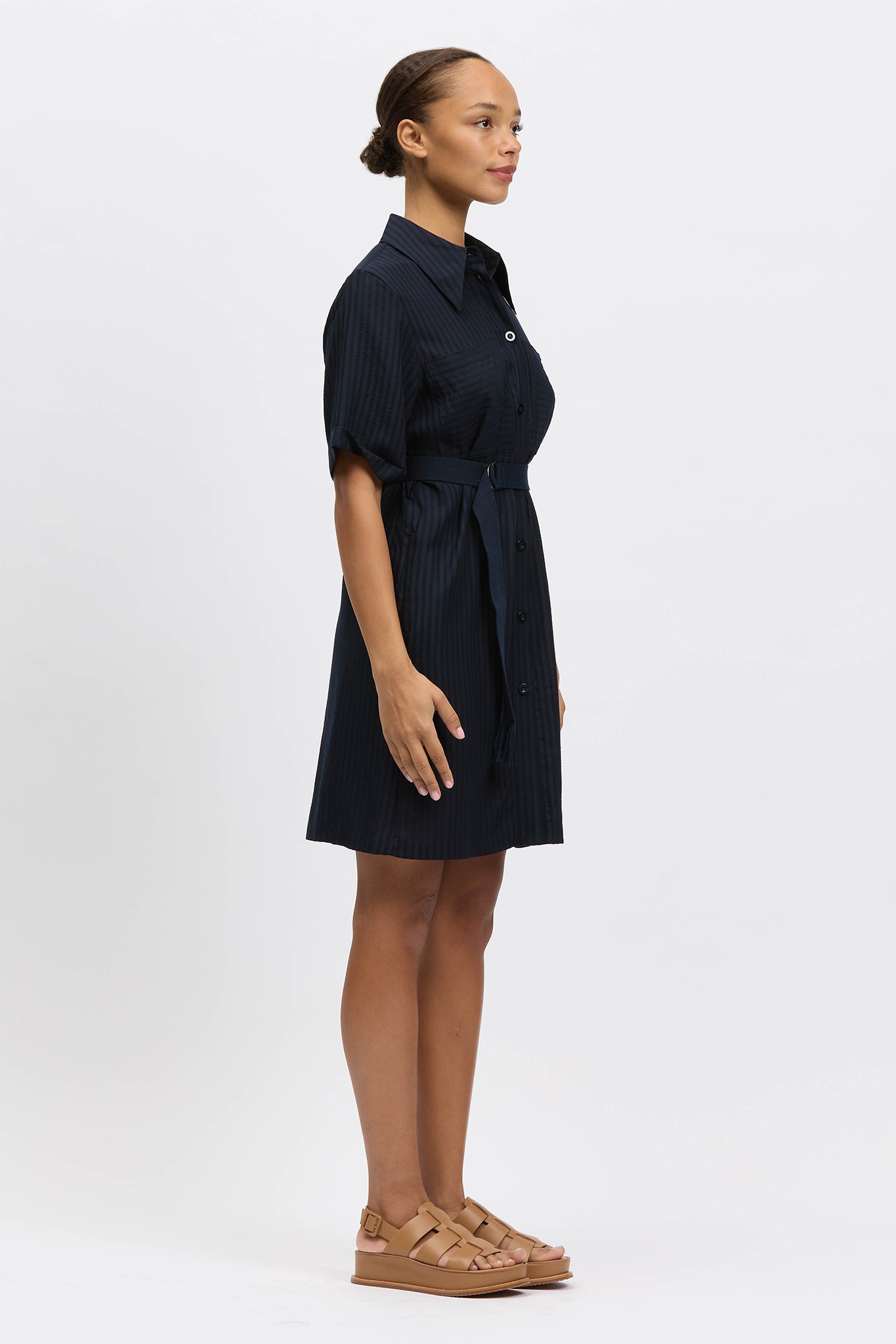 Woman wearing navy shirt dress