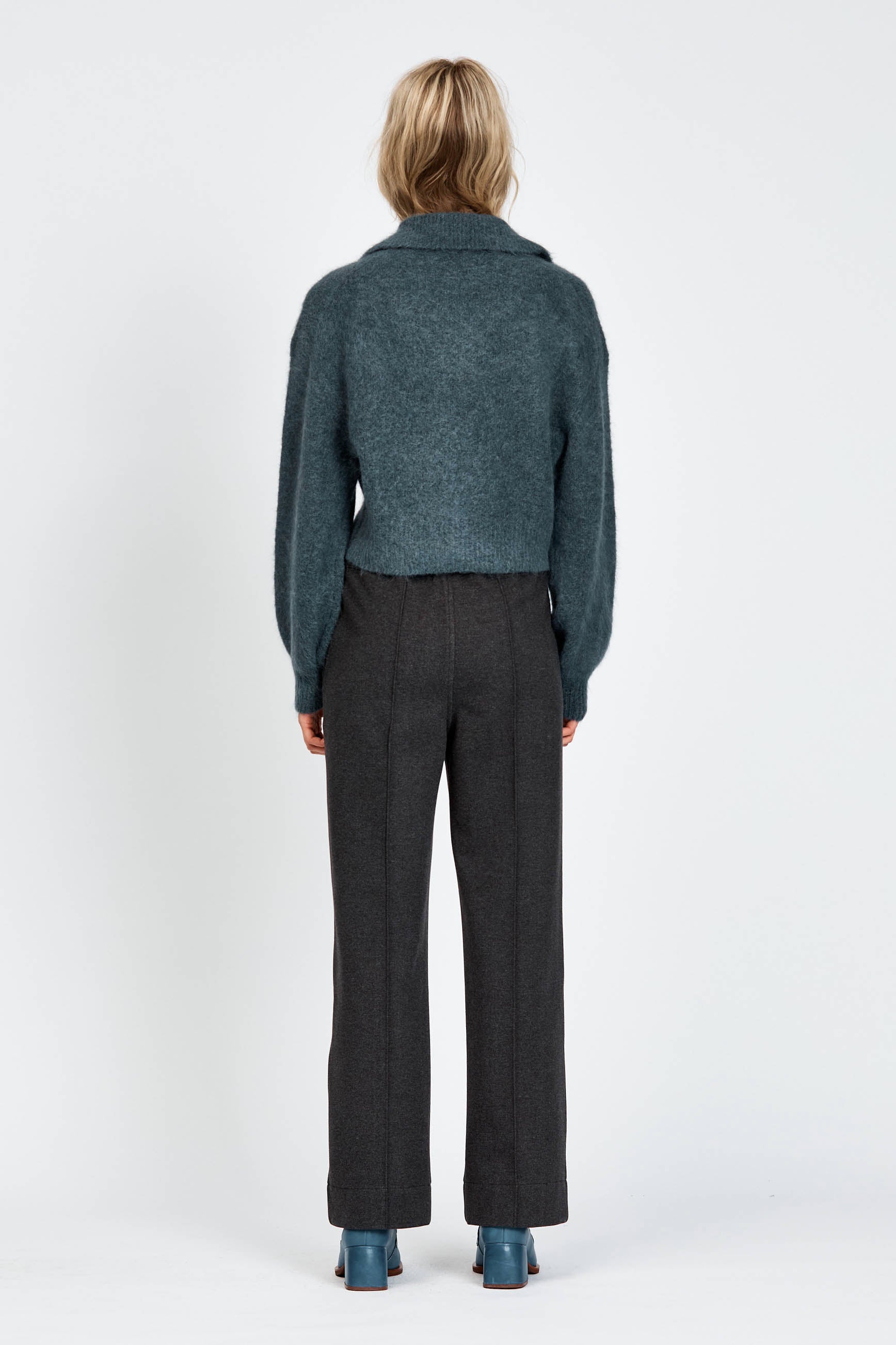 Woman wearing a fluffy woollen cardigan in navy