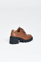 Brown leather lace up show with black sole and heel