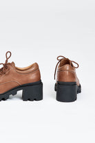 Brown leather lace up show with black sole and heel