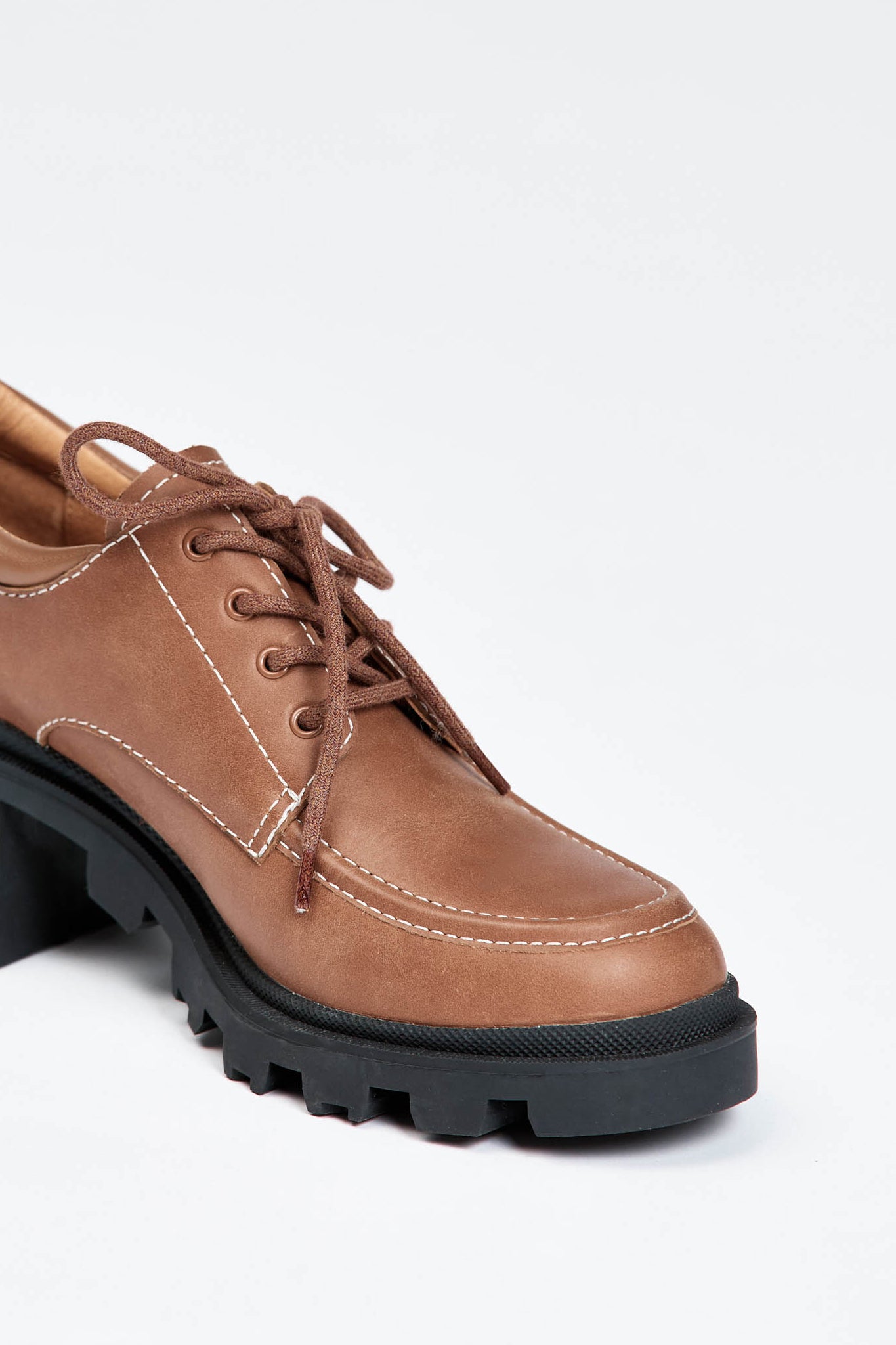 Brown leather lace up show with black sole and heel