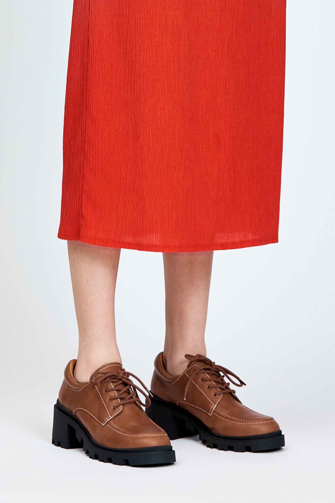 Brown leather lace up show with black sole and heel