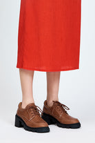 Brown leather lace up show with black sole and heel