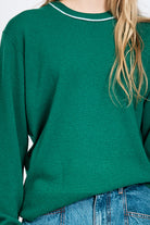 Women wearing green knitted jumper