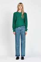 Women wearing green knitted jumper