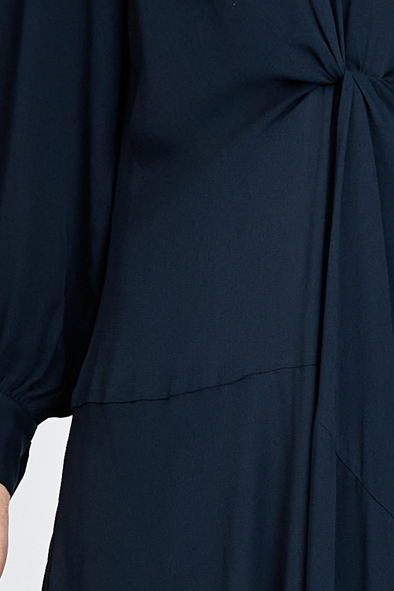Model wearing a navy long sleeve midi dress