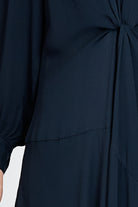 Model wearing a navy long sleeve midi dress