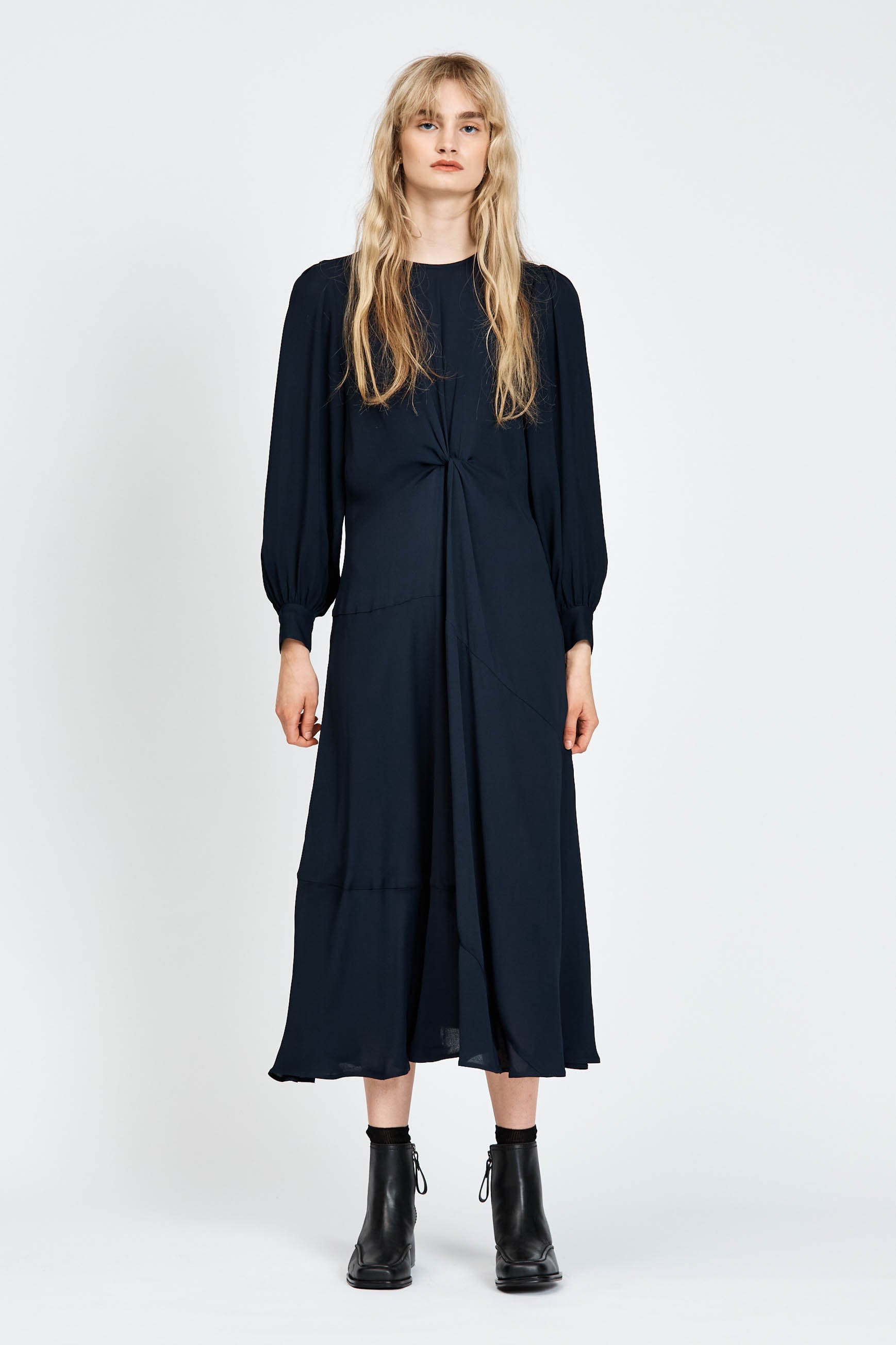 Model wearing a navy long sleeve midi dress