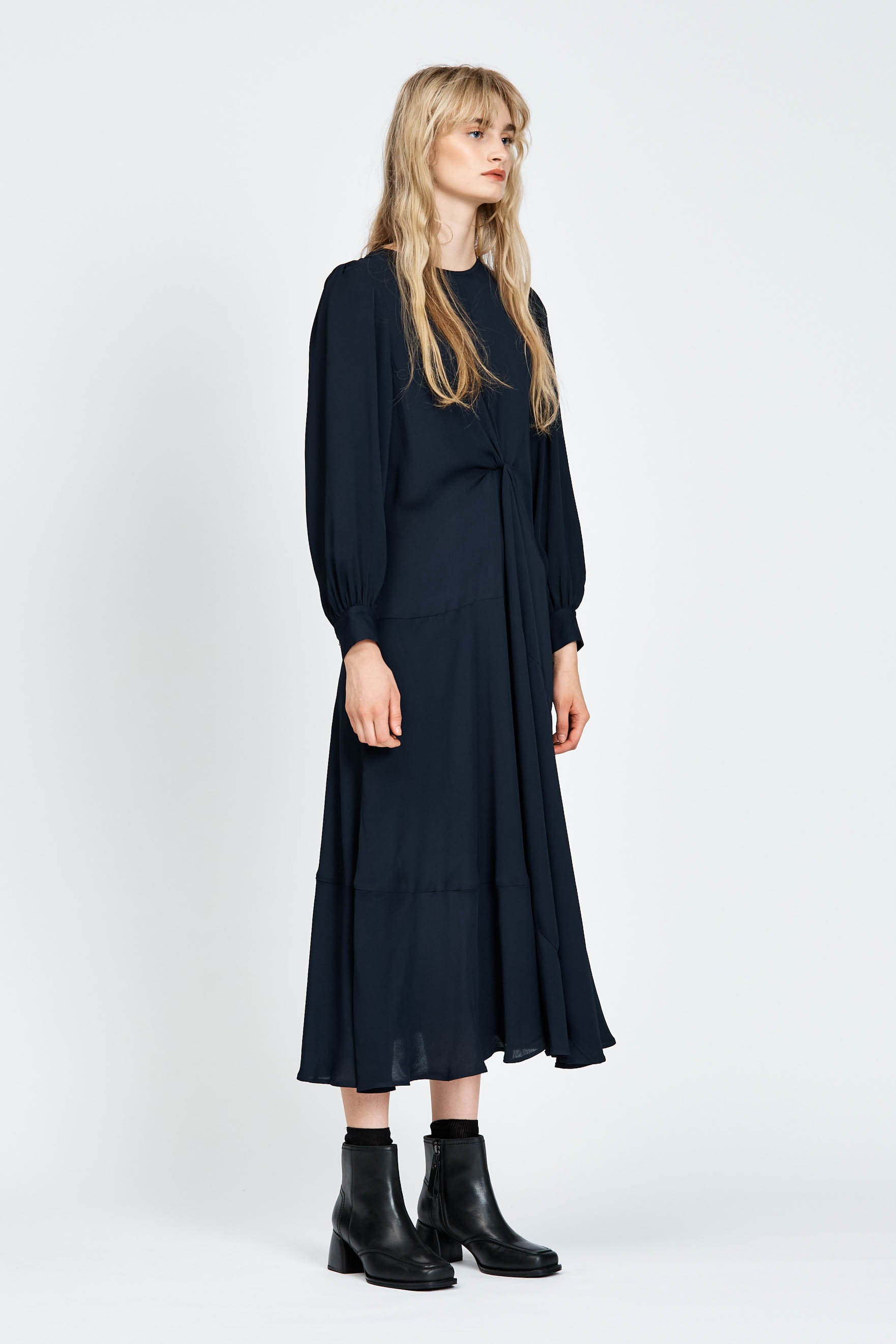 Model wearing a navy long sleeve midi dress