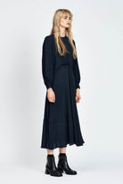 Model wearing a navy long sleeve midi dress