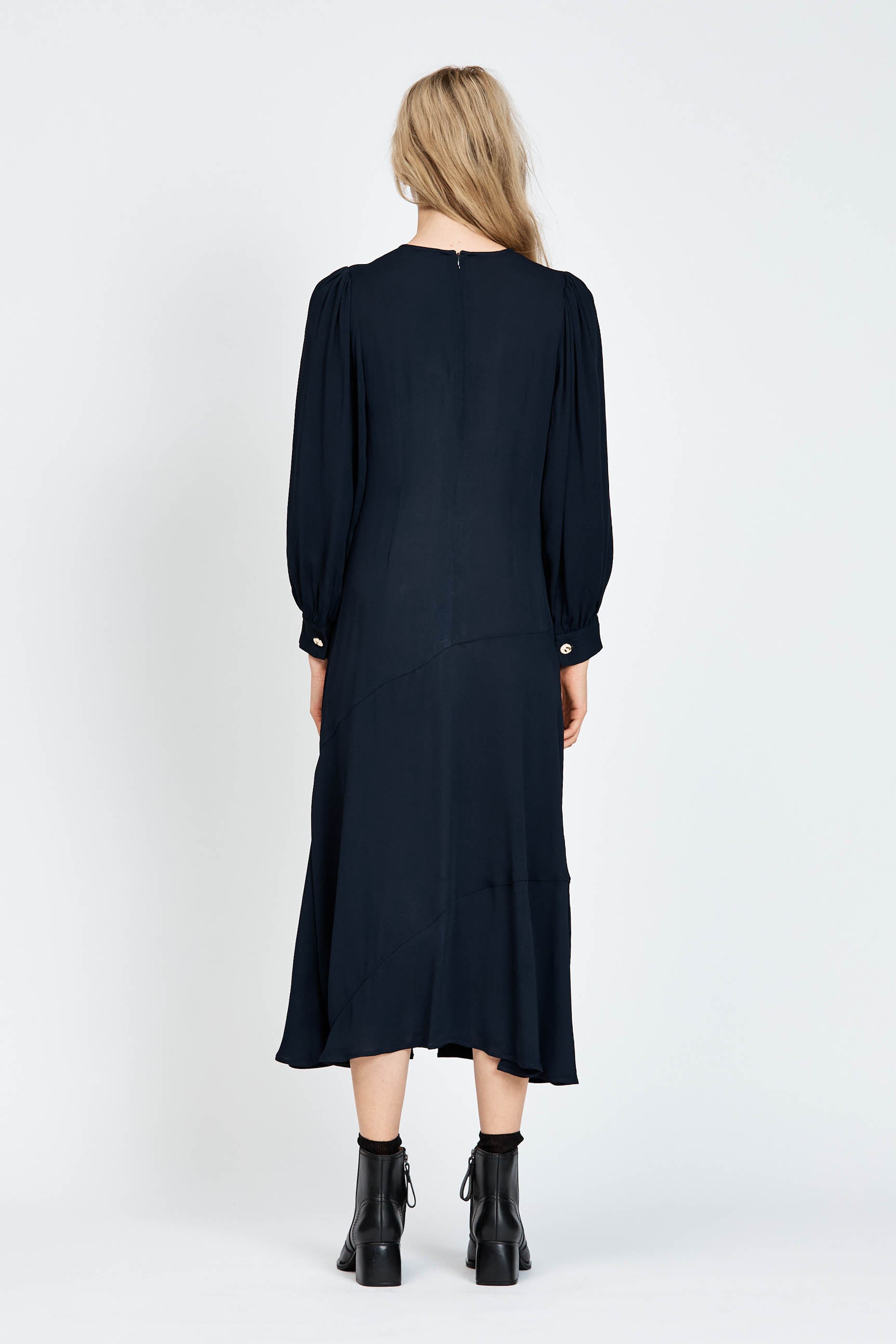 Model wearing a navy long sleeve midi dress