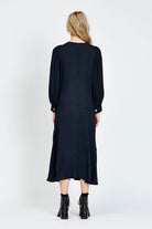 Model wearing a navy long sleeve midi dress