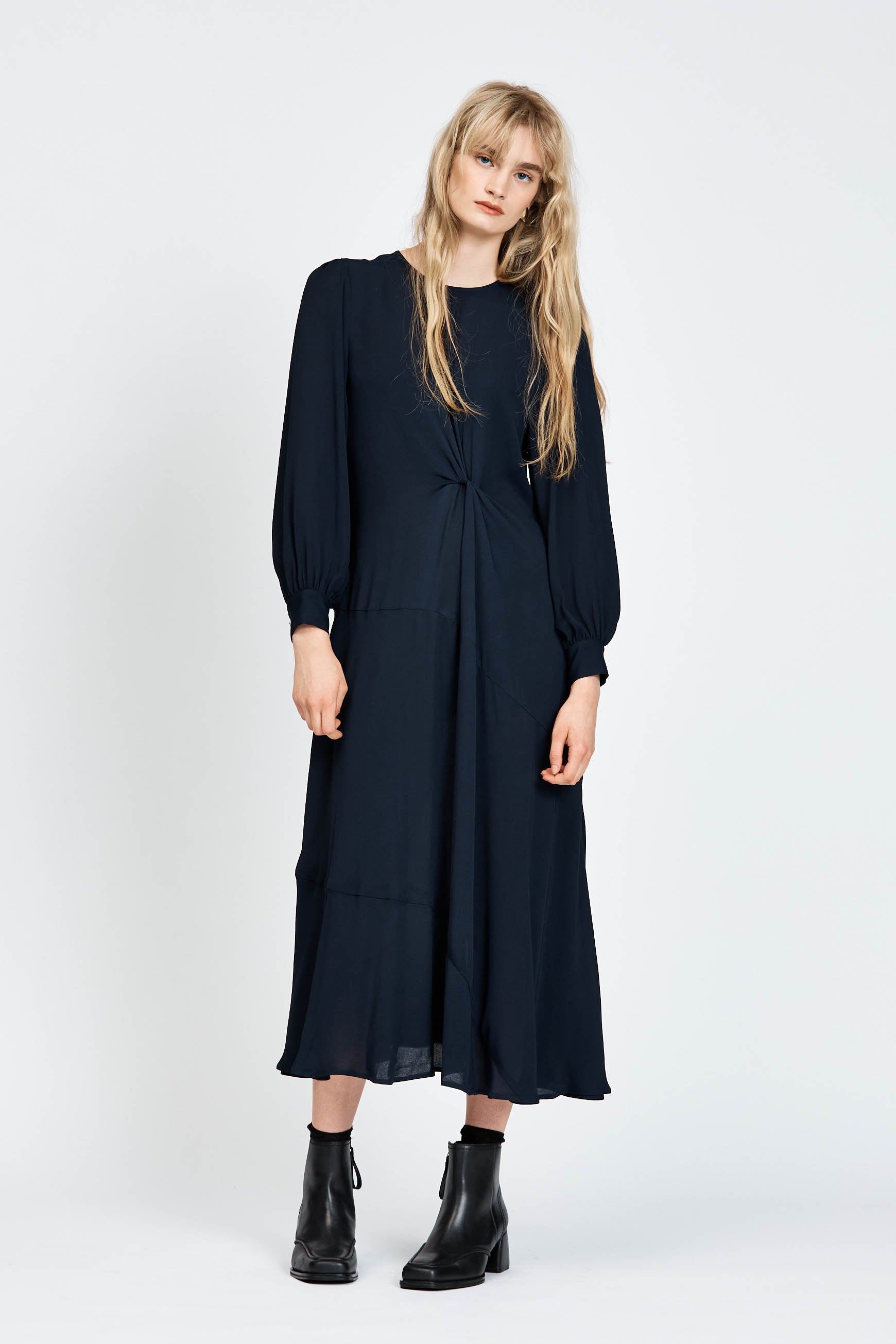 Model wearing a navy long sleeve midi dress