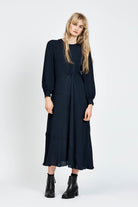 Model wearing a navy long sleeve midi dress