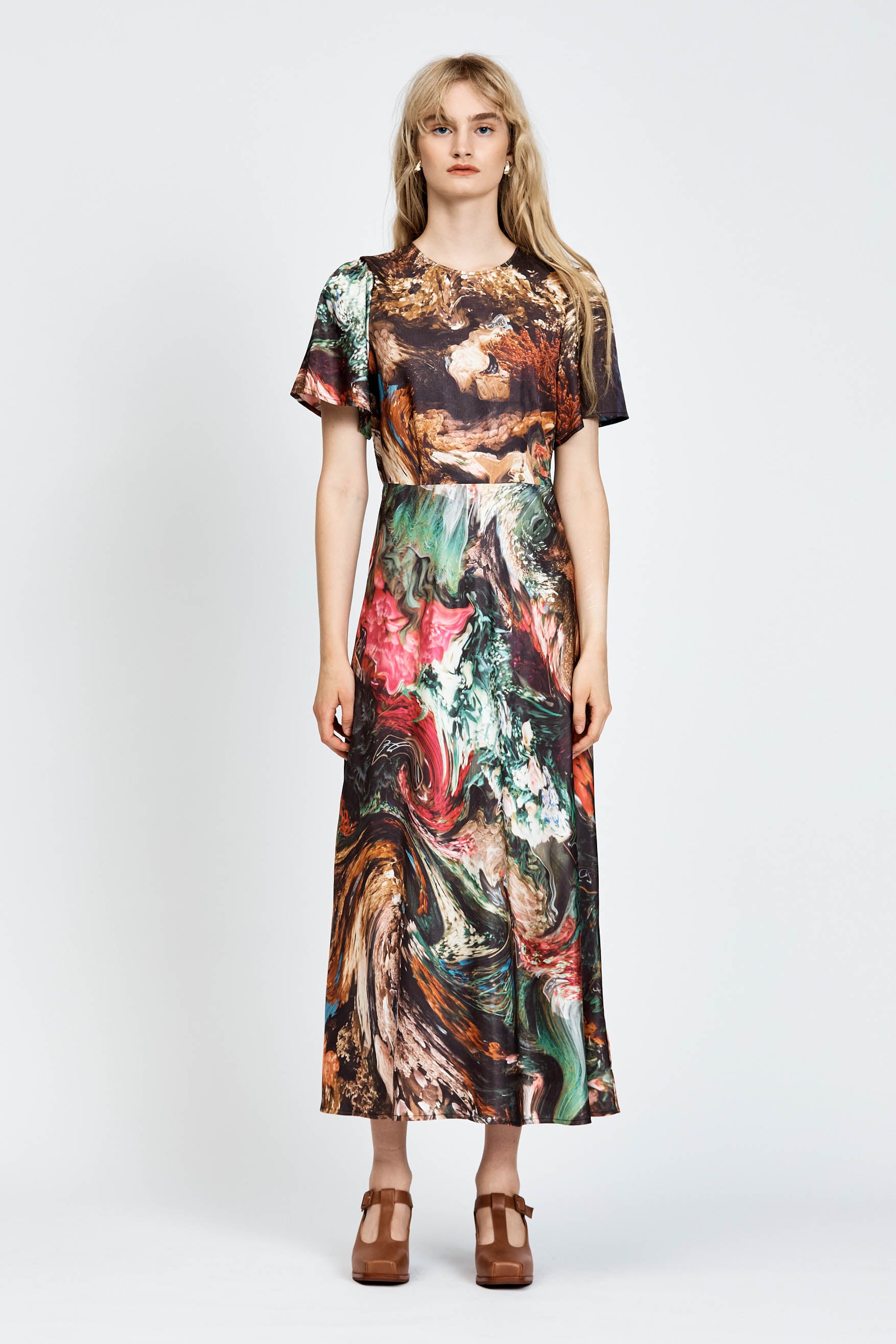Model wearing a short sleeve floral dress in midi length