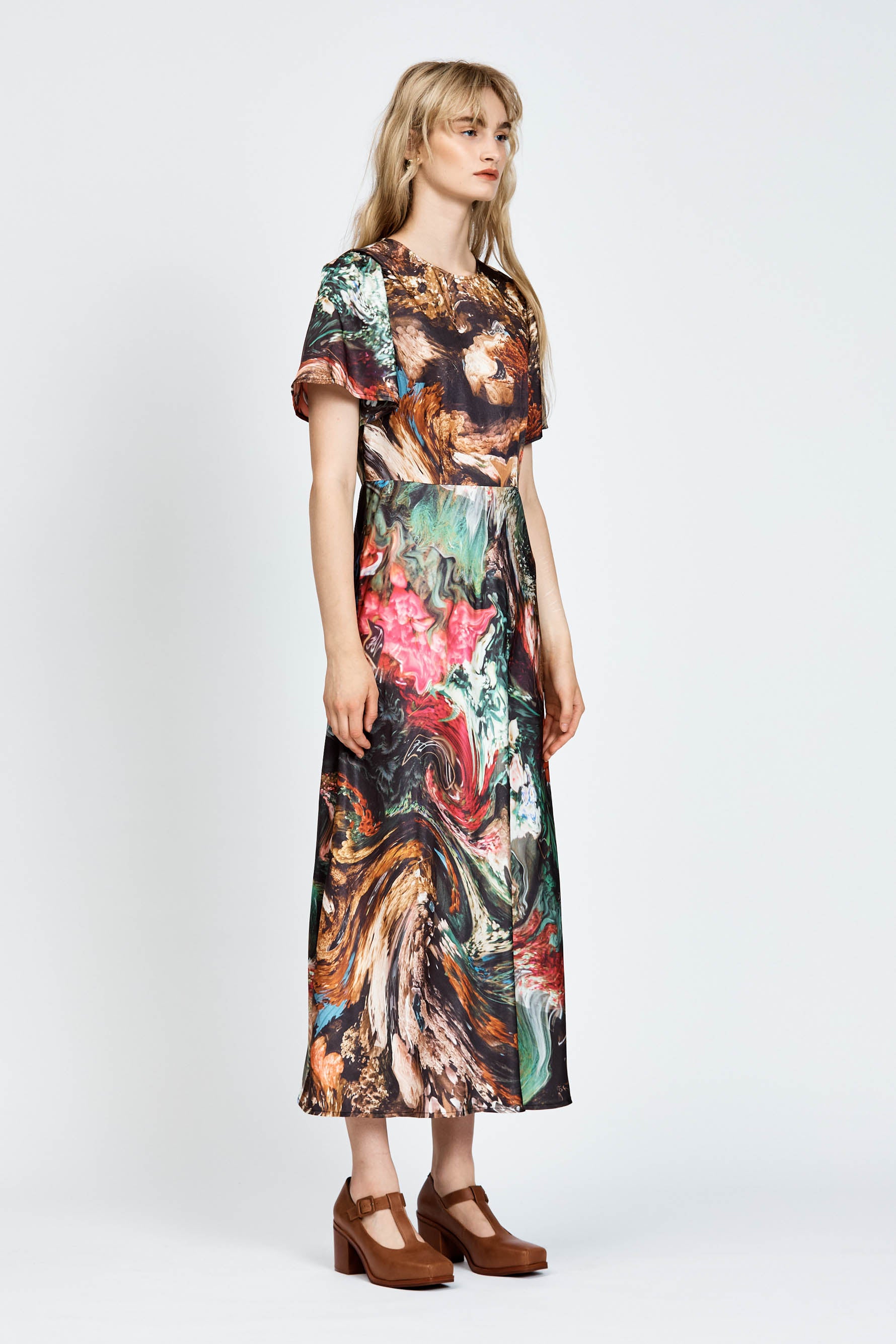 Model wearing a short sleeve floral dress in midi length